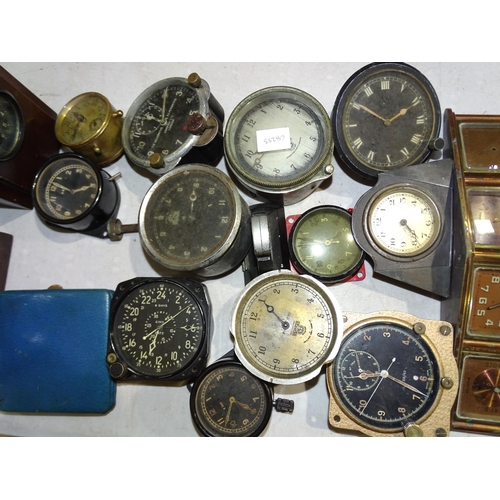 35 - A collection of Smiths and other car clocks, alarm clocks and miscellaneous items.