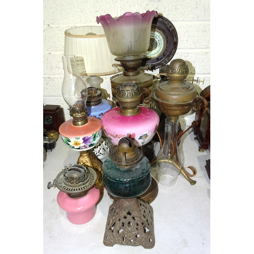 36 - A collection of Victorian and later oil lamps, mainly with glass reservoirs, (some damage), includin... 