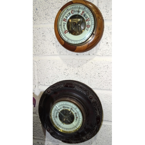 39 - A walnut-cased aneroid barometer/thermometer/hydrometer and other barometers.