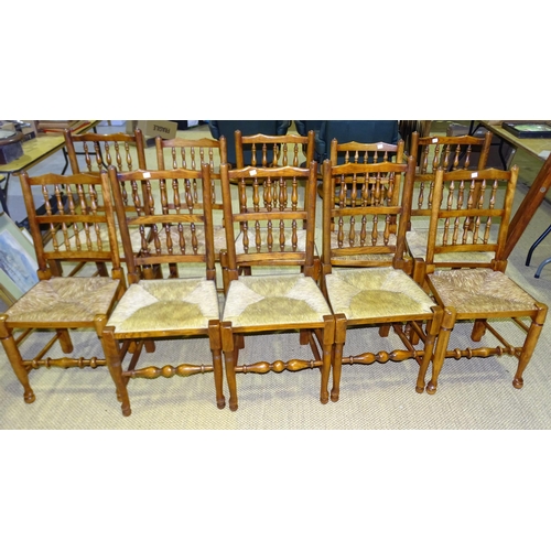 4 - A harlequin set of ten reproduction stained wood country dining chairs with spindle backs and rush s... 