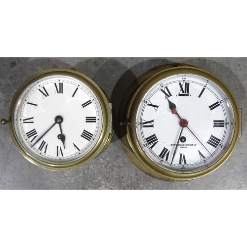 50 - A brass bulkhead clock, the circular enamel dial signed Smiths English Clocks Ltd, 24cm diameter and... 