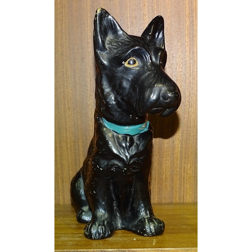 57 - A SylvaC black-glazed Scottie dog stamped 1208, with painted eyes and collar, 22cm high.... 