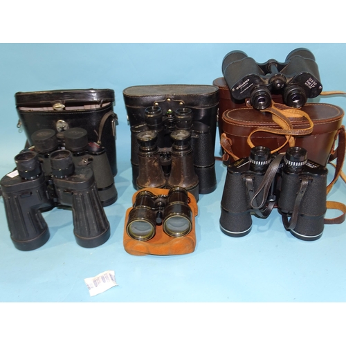 82 - A collection of seven pairs of binoculars, including Dollond 10x50 Field, Hilkinson 10x50 Field, Rus... 