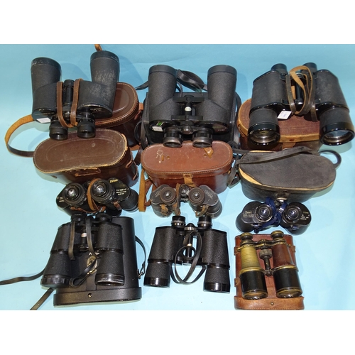 83 - A collection of nine pairs of binoculars: Canon 7x50 no.25521, Zenith Zoom 7x-12x40, Swift Belm... 