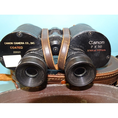 83 - A collection of nine pairs of binoculars: Canon 7x50 no.25521, Zenith Zoom 7x-12x40, Swift Belm... 