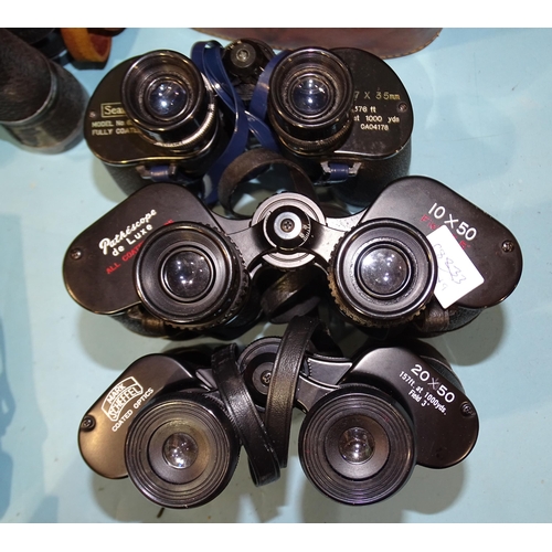 83 - A collection of nine pairs of binoculars: Canon 7x50 no.25521, Zenith Zoom 7x-12x40, Swift Belm... 