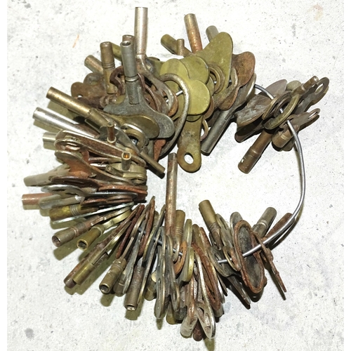 93 - A large collection of approximately 80 brass and metal clock keys.