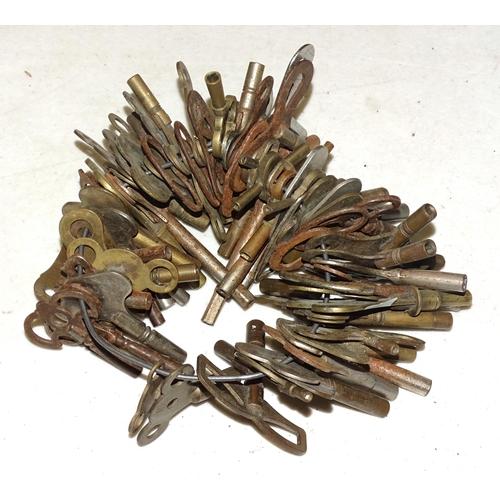 93 - A large collection of approximately 80 brass and metal clock keys.