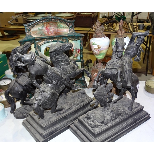 99 - A painted spelter Marly horse, two spelter models of knights, a printed porcelain chimney clock, (mo... 