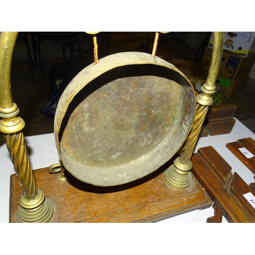 87 - A brass gong on stand, with beater, and other items.