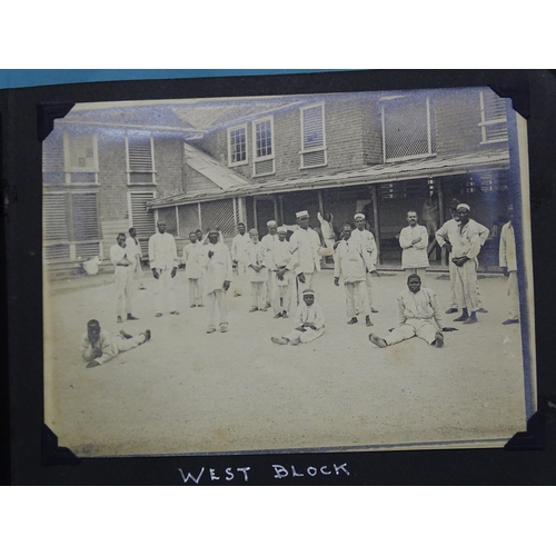 114 - An early-20th century album of twenty-two 12 x 16cm photographs of a hospital, staff and surrounding... 