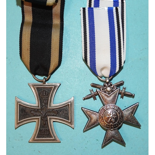 216 - A WWI Bavarian War Merit Cross (2nd Class), marked D for Deschler and a 1914 Iron Cross (2nd Class),... 