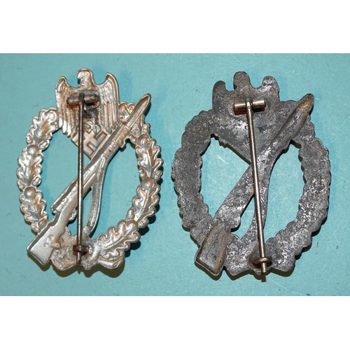 223 - A German Army Waffen SS Infantry Assault Badge in silver-grade pressed metal and another, diecast me... 