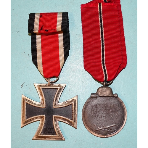 230 - A WWII Iron Cross (2nd Class) and a 1941-42 Eastern Front Medal, (2).