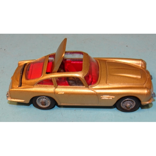 241 - Corgi Toys, no.261 James Bond's Aston Martin D.B.5, gold body, red interior, driver, (no baddies), b... 