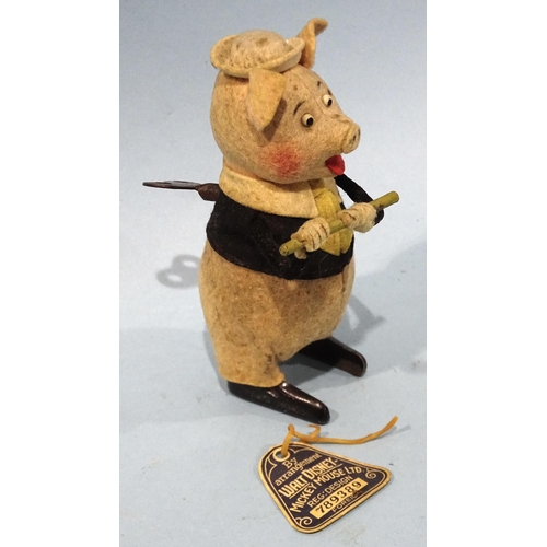 285 - A Schuco for Walt Disney c/w felt-covered tinplate pig playing a flute c1930's, 12cm high, with orig... 