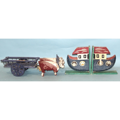 286 - A collection of wooden toys: a pull-along Folk Art cow, a pull-along horse and bowser, a pair of oxe... 