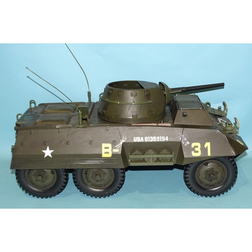 310 - A Hasbro US four-seater armoured car, a 1/6th-scale field gun and another armoured car, (3).... 