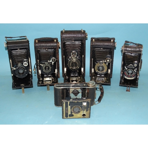 370 - Six pocket folding cameras: Kodak 1, 1A, 3A, Zeiss Ikon, Voightländer, etc, (some a/f), three with c... 