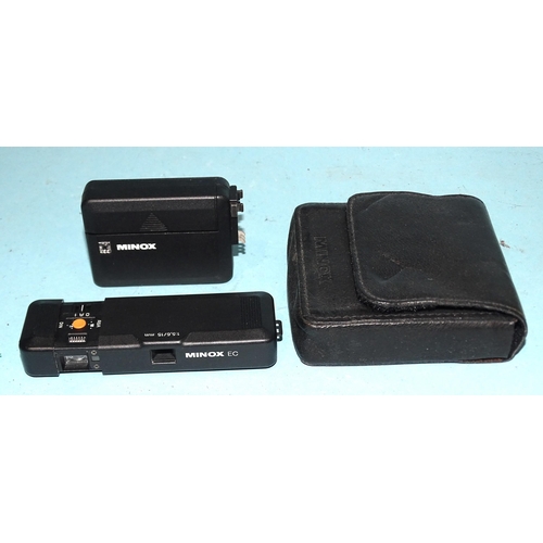 373 - A Minox EC sub-miniature camera with flash unit, in pouch, two Minolta 16 film cartridges, two 