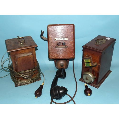 386 - A wall-mounted telephone with bell and Bakelite hand set and two mahogany cased electric bells.... 