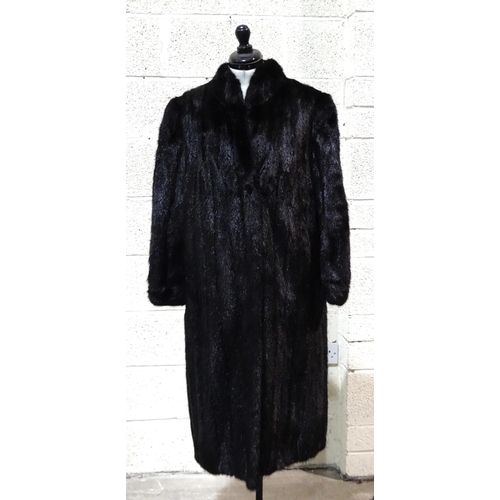 441 - A black mink full-length coat with stand-up collar and cuffed sleeves, no maker's label, size 12 app... 