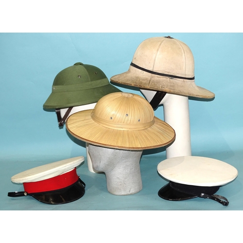 443 - Two canvas pith helmets, a straw pith helmet and two caps, (5).