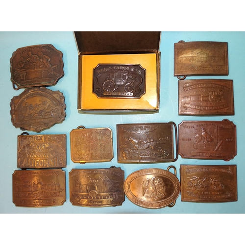 450 - A collection of thirteen 'Western' brass belt buckles, mainly 