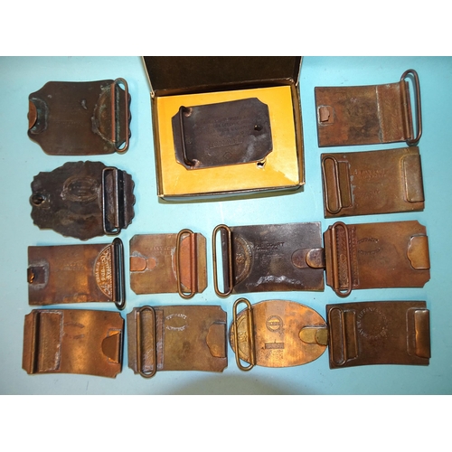 450 - A collection of thirteen 'Western' brass belt buckles, mainly 