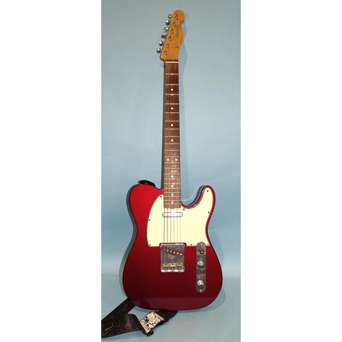 467 - A Fender Telecaster, made in Mexico, with metallic red and cream body, no.MX14468249.... 