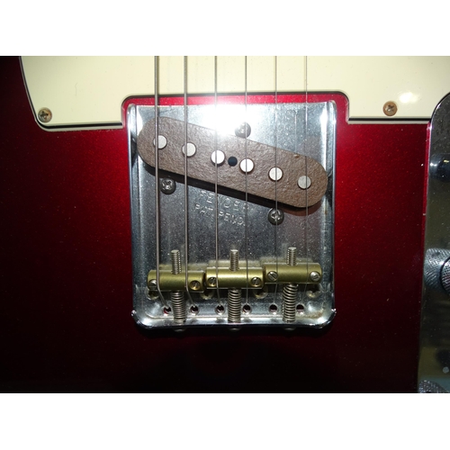 467 - A Fender Telecaster, made in Mexico, with metallic red and cream body, no.MX14468249.... 