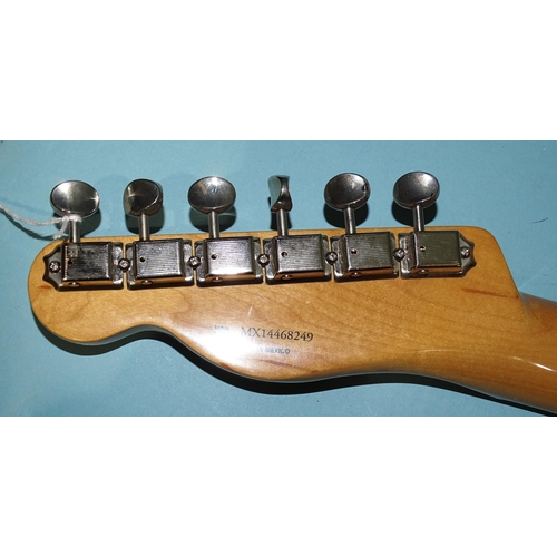 467 - A Fender Telecaster, made in Mexico, with metallic red and cream body, no.MX14468249.... 