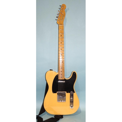 468 - A similar electric guitar, made in Mexico, with cream and black body, (wear to centre of back), no.M... 