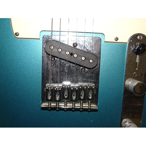 469 - A similar guitar, made in Mexico, with blue and cream body, no.MZ9368219.