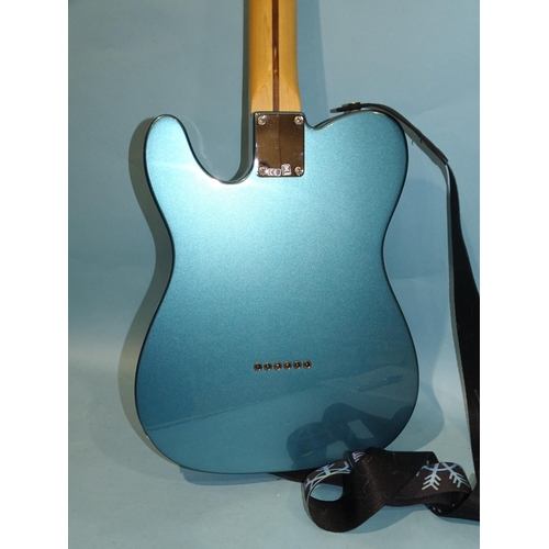 469 - A similar guitar, made in Mexico, with blue and cream body, no.MZ9368219.