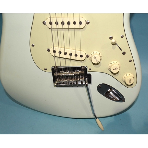 471 - A similar guitar, with pale blue and cream body, Sync Trem no.MZ9443816.