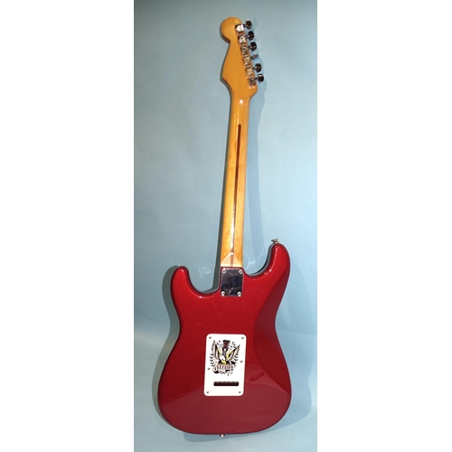 472 - A similar guitar, with striped metallic red and black body, made in Mexico, no.MN4150556.... 