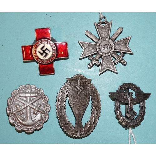 236 - A group of reproduction German badges: a Free Balloon Commander's badge, a police cap badge, a Natio... 