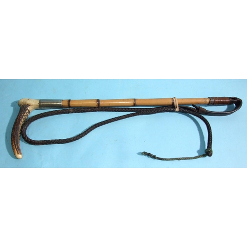 396 - An early-20th century hunting whip with bamboo and stag antler handle and plaited leather lash, the ... 