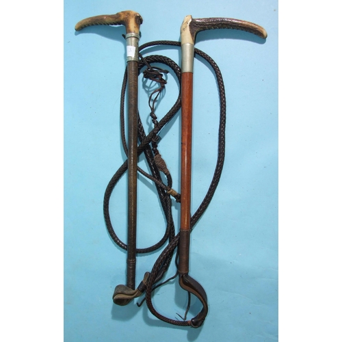 400 - Two early-20th century hunting whips with antler handles and plaited leather lashes, (2).... 