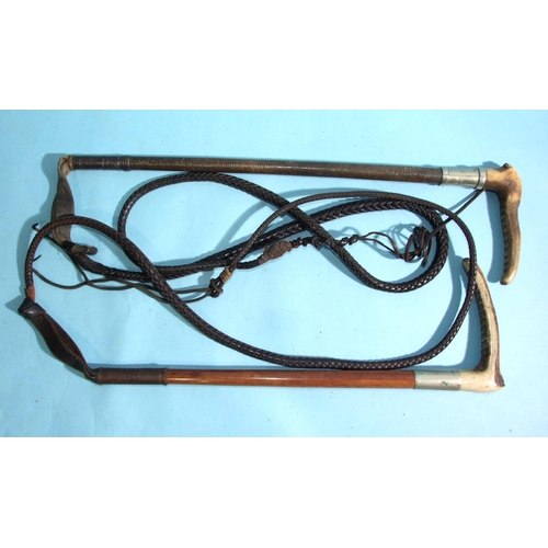 400 - Two early-20th century hunting whips with antler handles and plaited leather lashes, (2).... 