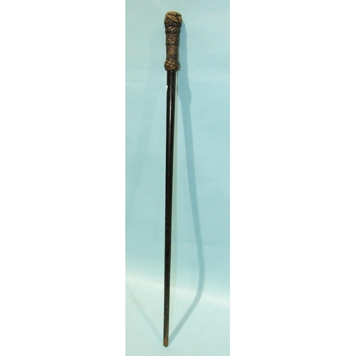 402 - A lacquered hardwood cane with woven rope knot handle, 83cm long.