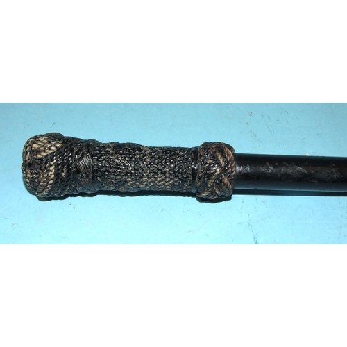 402 - A lacquered hardwood cane with woven rope knot handle, 83cm long.