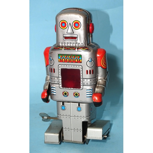 280 - A Japanese tinplate clockwork walking robot by SY Toys, 17.5cm high.