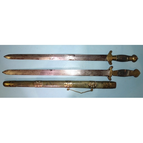 391 - A Chinese double-sword, the 21½'' (54.5cm) blades with string-bound grips, brass-mounted overall, wi... 