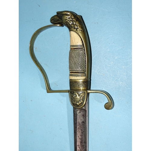 392 - An American officer's sword, the 75cm blade engraved with devices, canon and lances, the brass guard... 