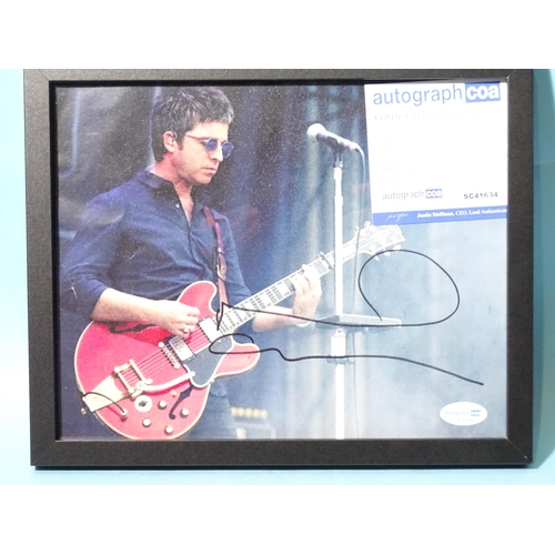 496 - Noel Gallagher, a signed coloured photograph, 19 x 24cm, with Autograph certificate of authenticity ... 