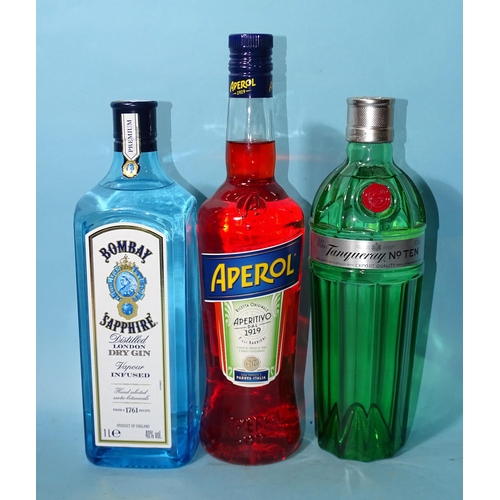 509 - Bombay Sapphire Gin (x1) 40% 1L, Tanqueray No.10 (x1) 47.3% 70cl and Aperol (x1) 11% 70cl, (3).... 