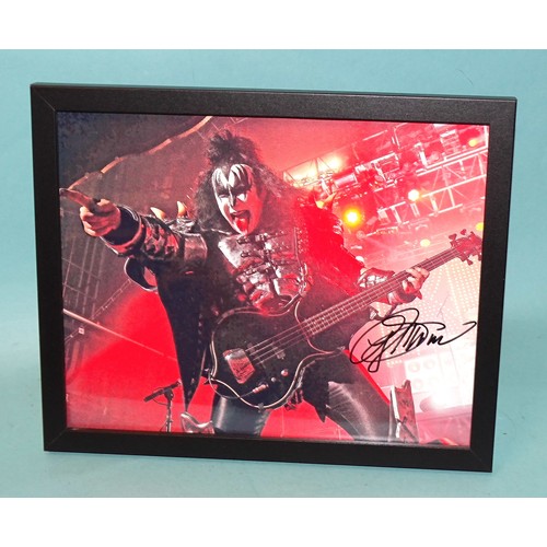 491 - Gene Simmons, bassist/vocalist with the rock band Kiss, a signed coloured photograph 19.5 x 24.5cm, ... 