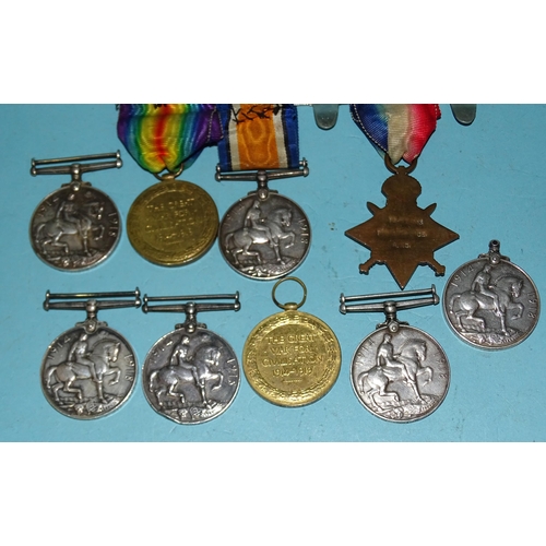 183 - Nine WWI medals: 1914-15 Star, (name removed), British War (x7, one name removed) and Victory (x2).... 